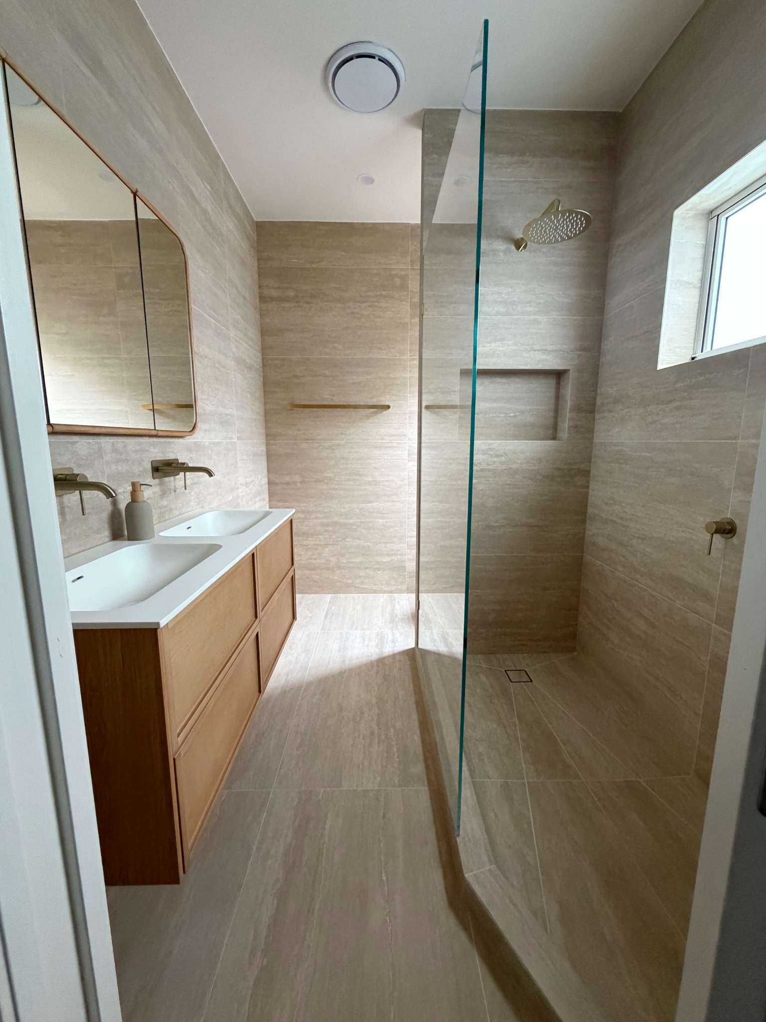 Double vanity bathroom and glass shower