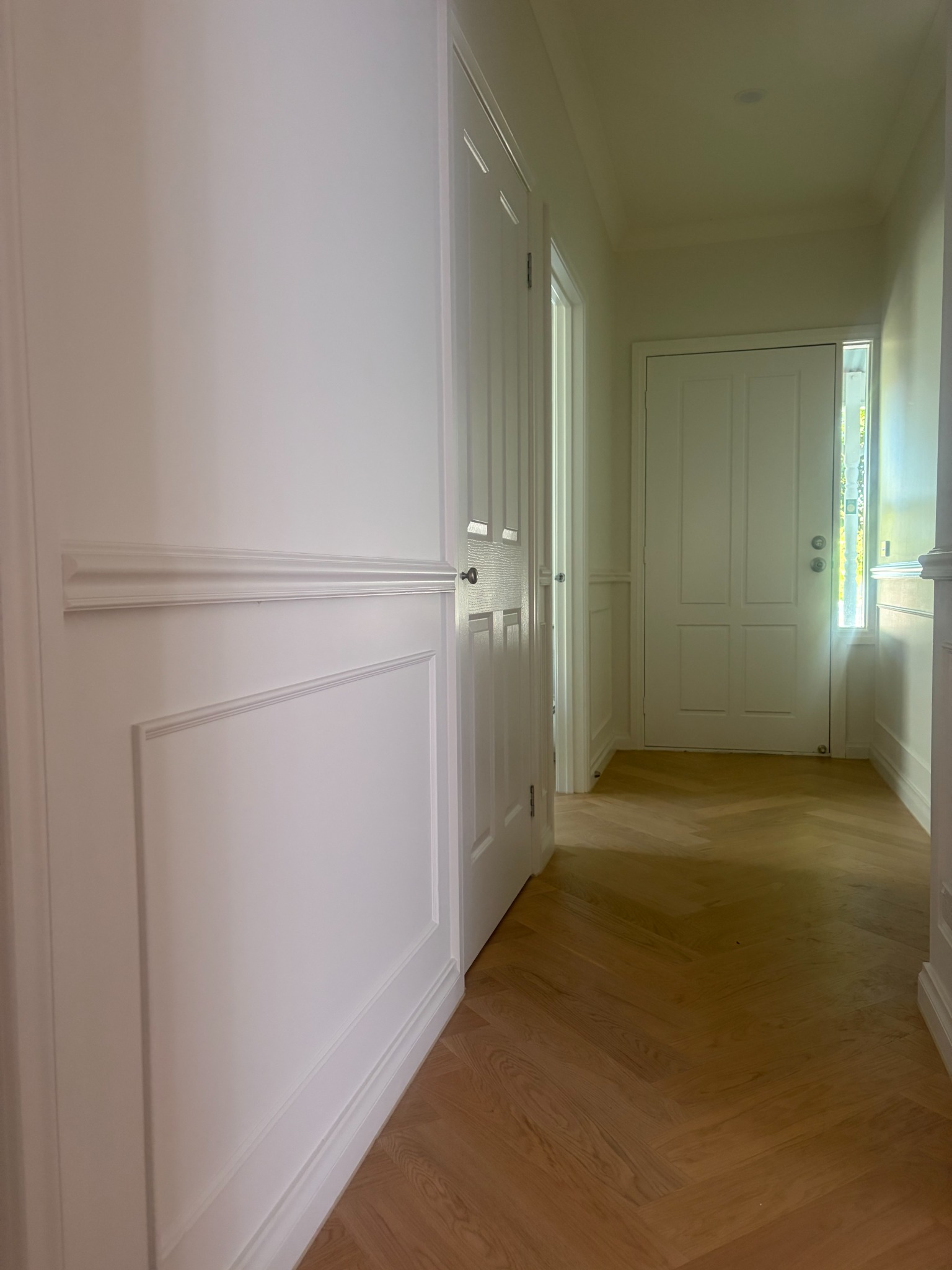 Hallway mouldings and herringbone flooring